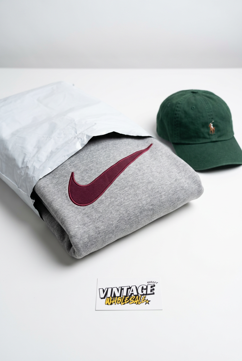 Vintage Nike hoodie and Ralph Lauren cap packed for a bulk order